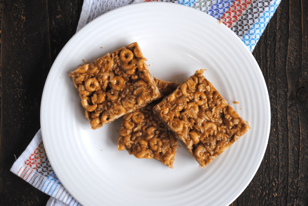 Healthy Cheerio Bars (Gluten-free, Refined sugar-free) | I'm always looking for healthy snacks, for myself and my toddler. With additions like flax seeds, oats, coconut, and walnuts, these bars take classic cheerios to the next level. And your kids will love the combination of cheerios, honey and peanut butter!