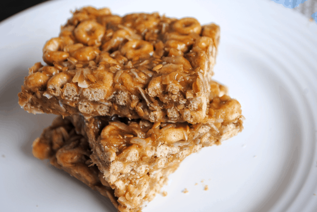 Healthy Cheerio Bars (Gluten-free, Refined sugar-free) | I'm always looking for healthy snacks, for myself and my toddler. With additions like flax seeds, oats, coconut, and walnuts, these bars take classic cheerios to the next level. And your kids will love the combination of cheerios, honey and peanut butter!