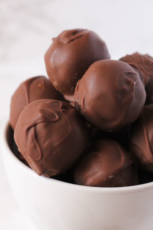 close up view of double chocolate truffles in a bowl