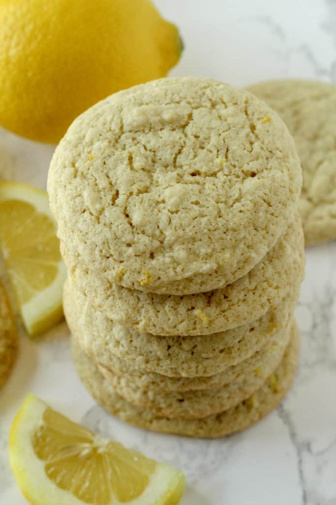 a stack of Lemon Cookies with lemon slices around