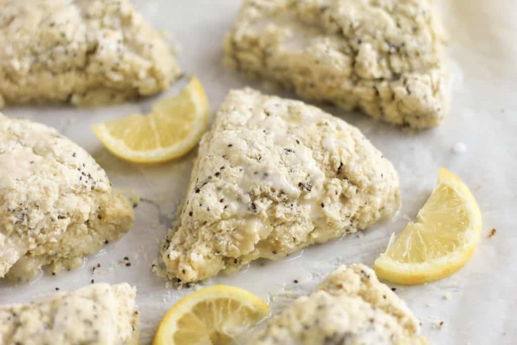 side view of Lemon Chia Scones with lemon slices scattered around