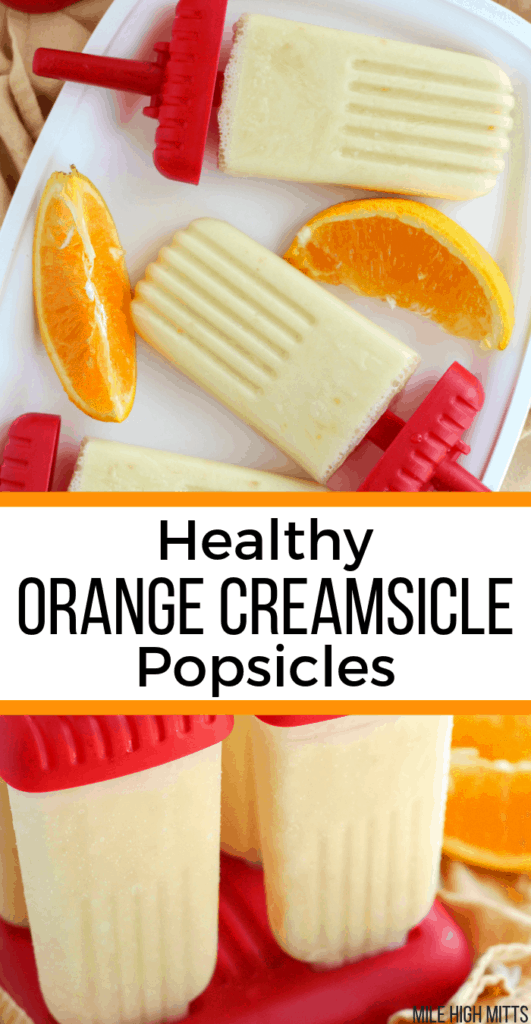 Orange Creamsicle Popsicles in a Popsicle mold and on a tray with orange slices