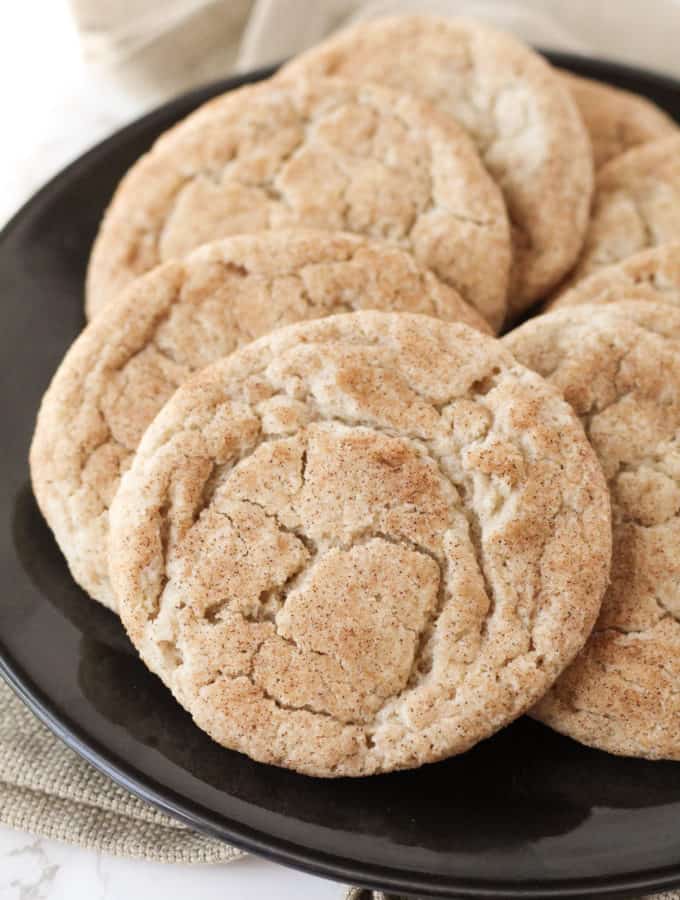 A close up of snickerdoodles on a plate