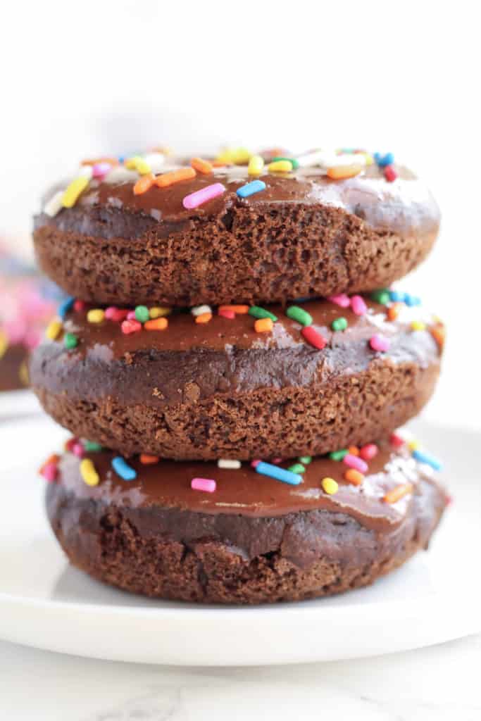A stack of three Chocolate Donuts