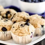 A close up of tray of muffins and blueberries