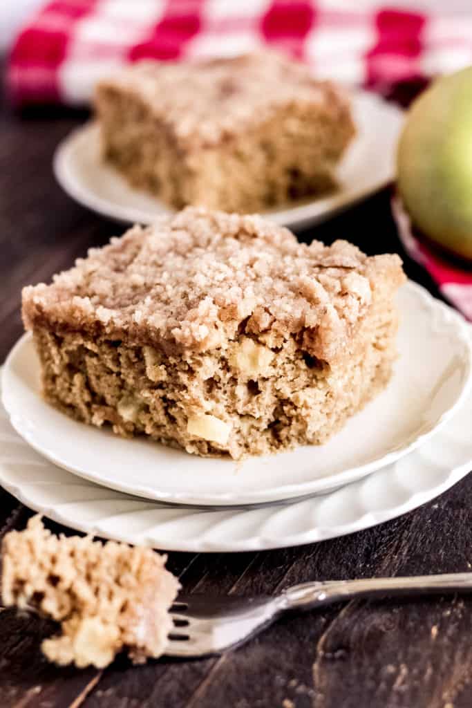 piece of apple cinnamon coffee cake with a bite taken out of it