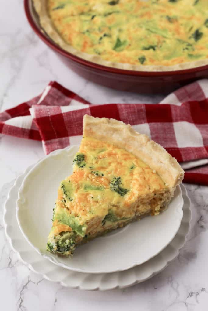 One slice of quiche on a plate