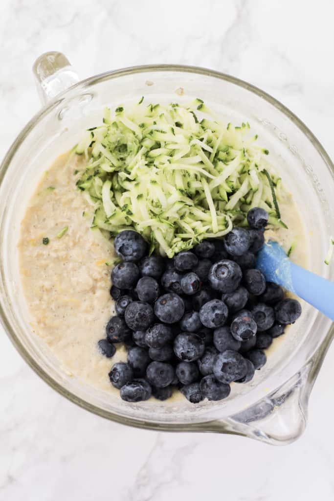 Bowl of oatmeal unbaked with zucchini and blueberries