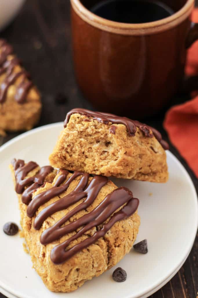 Scones on a plate with a chocolate glaze and chocolate chips