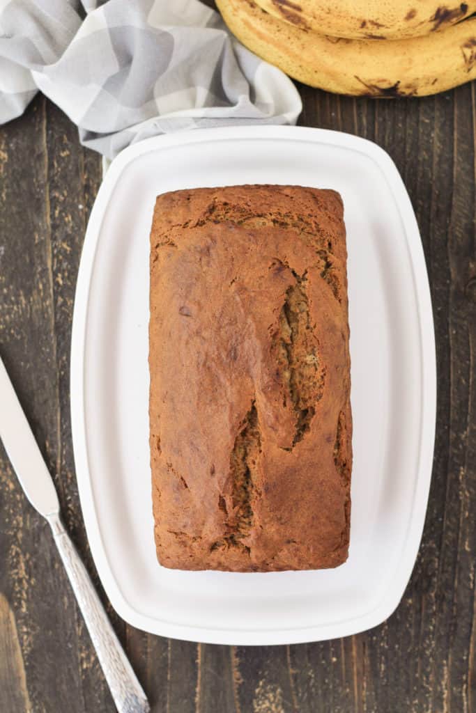 A loaf of banana bread on a tray.