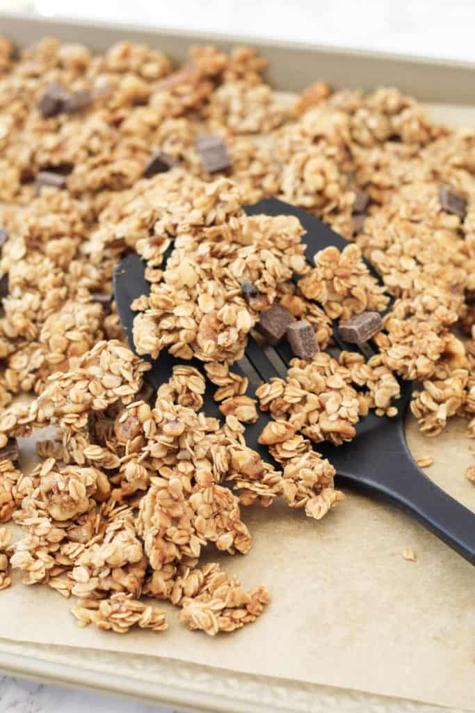 Pan of granola with a spatula