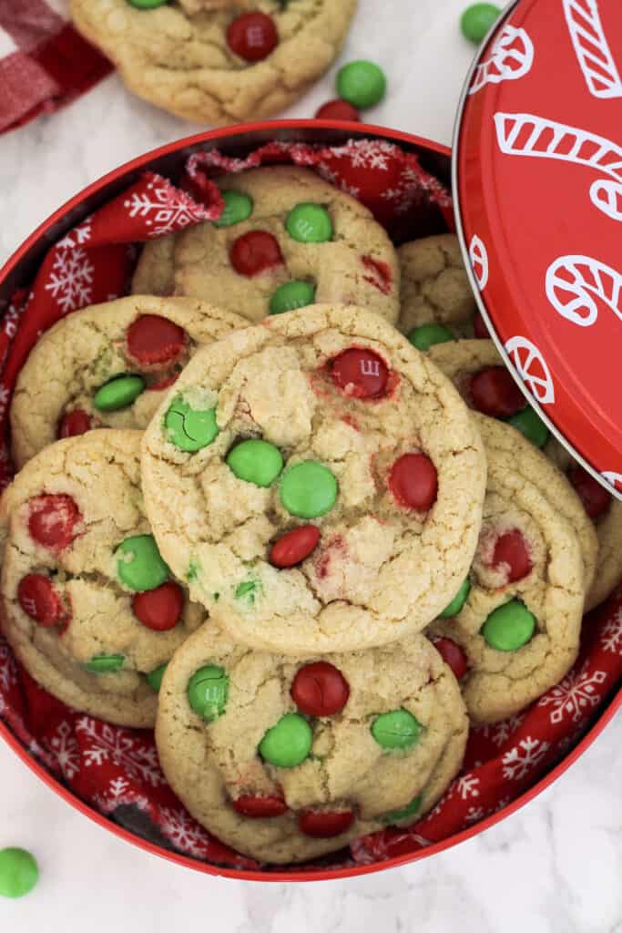 Close up of a pile of cookies in a tin.